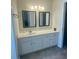 Bathroom vanity featuring double sinks, mirrors, and modern fixtures at 203 Arbor Oaks Dr, Summerville, SC 29485