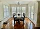 Sunlit dining room with a large table, hardwood floors, and classic finishes at 203 Arbor Oaks Dr, Summerville, SC 29485