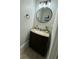Stylish powder room with modern fixtures, granite vanity, and a decorative mirror at 203 Arbor Oaks Dr, Summerville, SC 29485