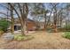Large backyard with trees, playset, patio, fire pit and screened-in porch at 2072 Middleburg Ln, Mount Pleasant, SC 29464