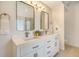 Bright bathroom features double sink vanity, with white cabinets, quartz counters, and brass fixtures at 2072 Middleburg Ln, Mount Pleasant, SC 29464