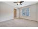 Empty bedroom with neutral carpet flooring, ceiling fan, and window with blinds at 2072 Middleburg Ln, Mount Pleasant, SC 29464