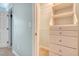 Spacious closet with custom shelving and drawers and carpet flooring at 2072 Middleburg Ln, Mount Pleasant, SC 29464