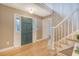 Spacious foyer featuring hardwood floors, a staircase, and a stylish front door with sidelights at 2072 Middleburg Ln, Mount Pleasant, SC 29464