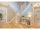 Bright foyer showcasing hardwood floors, a staircase, and a decorative console table at 2072 Middleburg Ln, Mount Pleasant, SC 29464