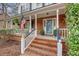 Inviting front porch with brick steps and white railings, perfect for relaxing outdoors at 2072 Middleburg Ln, Mount Pleasant, SC 29464