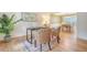 This home office includes wood floors, bright lighting, and shares space with a dining room at 2072 Middleburg Ln, Mount Pleasant, SC 29464