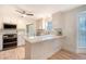 Updated kitchen with white cabinets, stainless steel appliances, and a breakfast bar at 2072 Middleburg Ln, Mount Pleasant, SC 29464