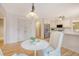 Eat-in kitchen features white cabinetry, stainless steel appliances, and a charming breakfast nook at 2072 Middleburg Ln, Mount Pleasant, SC 29464