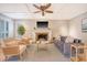 Cozy living room featuring a fireplace, ceiling fan, and stylish furnishings at 2072 Middleburg Ln, Mount Pleasant, SC 29464
