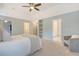 Spacious main bedroom featuring carpeted floors, natural light, and ensuite bathroom at 2072 Middleburg Ln, Mount Pleasant, SC 29464