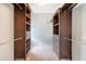 Walk-in closet features custom wood built-in shelving and drawers with carpet flooring at 2072 Middleburg Ln, Mount Pleasant, SC 29464
