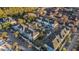 Aerial view of a condo community with colorful exteriors, mature trees, and ample parking at 2200 Belle Isle Ave # 103, Mount Pleasant, SC 29464