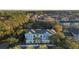 Picturesque aerial view featuring colorful condos surrounded by mature trees in a community with abundant parking at 2200 Belle Isle Ave # 103, Mount Pleasant, SC 29464
