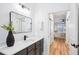 Bathroom featuring a quartz countertop, gray cabinets, and a view into the bedroom at 2200 Belle Isle Ave # 103, Mount Pleasant, SC 29464