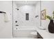 Well-lit bathroom showcasing a tub-shower with marble tile, black hardware, and a decorative honeycomb tile niche at 2200 Belle Isle Ave # 103, Mount Pleasant, SC 29464