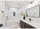 Modern bathroom with a white marble tiled shower, black fixtures, and a sleek vanity with quartz countertop at 2200 Belle Isle Ave # 103, Mount Pleasant, SC 29464