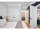 Bedroom with a view into the en suite bathroom, neutral decor, and ample closet space at 2200 Belle Isle Ave # 103, Mount Pleasant, SC 29464