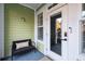 A cozy entryway featuring a bench, an exterior door with glass, and a secure smart lock at 2200 Belle Isle Ave # 103, Mount Pleasant, SC 29464