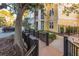 Apartment buildings with well-maintained landscaping and a wooden fence along the walkway at 2200 Belle Isle Ave # 103, Mount Pleasant, SC 29464
