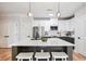 This modern kitchen features white upper and gray lower cabinets, stainless appliances and pendant lighting at 2200 Belle Isle Ave # 103, Mount Pleasant, SC 29464