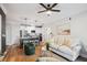 Stylish open-concept living area with modern furniture, a ceiling fan, and a gourmet kitchen view at 2200 Belle Isle Ave # 103, Mount Pleasant, SC 29464