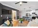 Chic open-concept living space with kitchen view, modern lighting, and an adjacent bathroom at 2200 Belle Isle Ave # 103, Mount Pleasant, SC 29464