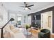 Cozy living area with a sofa, modern decor, and access to a balcony offering fresh air and natural light at 2200 Belle Isle Ave # 103, Mount Pleasant, SC 29464