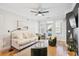 Bright living room with neutral decor, a view to an exterior patio, and comfortable seating at 2200 Belle Isle Ave # 103, Mount Pleasant, SC 29464