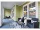 Inviting covered patio with comfortable seating, a stylish rug, and views of the surrounding landscape at 2200 Belle Isle Ave # 103, Mount Pleasant, SC 29464