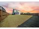 Large fenced-in backyard with well-maintained lawn and an enclosed sunroom providing extra living space at 225 Sedona Dr, Summerville, SC 29486