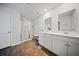 Bathroom featuring double sinks, a shower with glass door, and wood-look flooring at 225 Sedona Dr, Summerville, SC 29486
