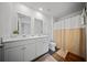 Well-lit bathroom features double sink vanity, a toilet, and a shower with curtain at 225 Sedona Dr, Summerville, SC 29486