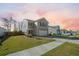 Charming two-story home featuring a manicured lawn and attached two-car garage at 225 Sedona Dr, Summerville, SC 29486