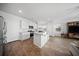 A bright kitchen area with white cabinets, stainless steel appliances, and hardwood flooring at 225 Sedona Dr, Summerville, SC 29486