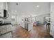 Spacious kitchen with island seating, stainless steel appliances, and an adjacent living area at 225 Sedona Dr, Summerville, SC 29486