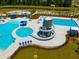 Community pool featuring a water slide, splash pad, and lounge chairs, with a pond view in the background at 225 Sedona Dr, Summerville, SC 29486