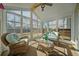 Inviting sunroom with natural light, wicker furniture, and backyard views at 225 Sedona Dr, Summerville, SC 29486