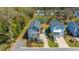 Beautiful elevated view of two coastal homes with manicured landscaping, pond, and neighborhood at 2322 Dorado Ct, Johns Island, SC 29455