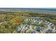Aerial shot showcasing a neighborhood with beautiful homes, a pond, and lush greenery at 2322 Dorado Ct, Johns Island, SC 29455