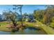 Aerial view of homes, pond, and lush landscaping in the community at 2322 Dorado Ct, Johns Island, SC 29455