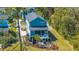 Aerial view of a gray home with a backyard fire pit and shade at 2322 Dorado Ct, Johns Island, SC 29455