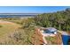 Aerial view showcases a charming pavilion nestled within a landscape near the serene waterfront at 2322 Dorado Ct, Johns Island, SC 29455