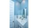 Cozy half bathroom with white wainscoting, vanity, modern fixtures, offering practical elegance at 2322 Dorado Ct, Johns Island, SC 29455