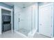 Modern bathroom with glass-enclosed shower, white subway tile, and convenient in-unit laundry hookups at 2322 Dorado Ct, Johns Island, SC 29455