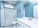 Well-lit bathroom featuring a tub-shower, white vanity with chrome faucet, and sleek tile flooring at 2322 Dorado Ct, Johns Island, SC 29455