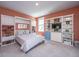 Multi-purpose room featuring a Murphy bed, built-in shelving, and a stylish blue mini fridge at 2322 Dorado Ct, Johns Island, SC 29455