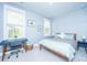 Calming bedroom with paneled walls, desk area, and a comfortable bed with blue accents at 2322 Dorado Ct, Johns Island, SC 29455
