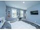 Comfortable bedroom with a bed, desk area, and natural light streaming in from two windows at 2322 Dorado Ct, Johns Island, SC 29455