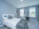 Cozy bedroom features natural light from two windows and a comfortable bed at 2322 Dorado Ct, Johns Island, SC 29455